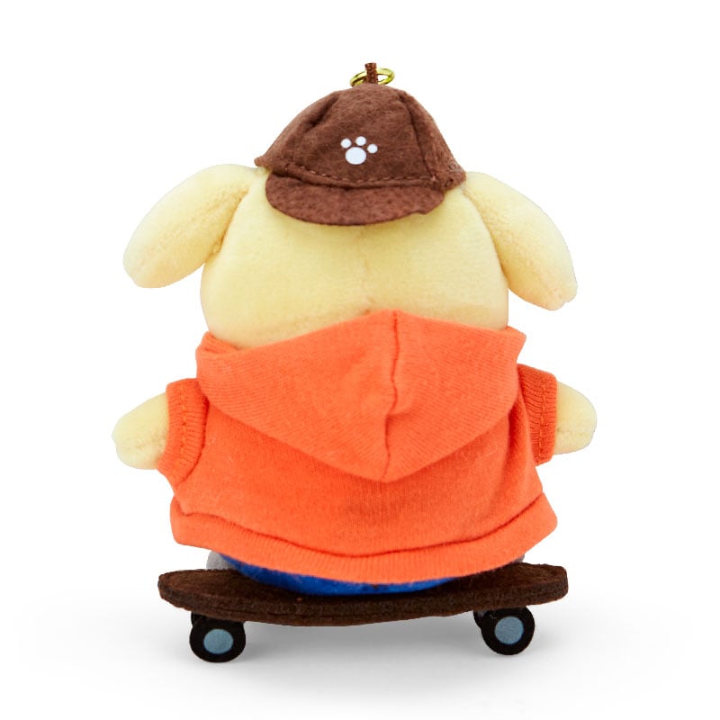 Pompompurin keychain displayed on a skateboard background, emphasizing its Sk8r Squad theme