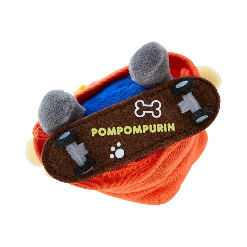 Pompompurin plush mascot keychain close-up, highlighting embroidered details
