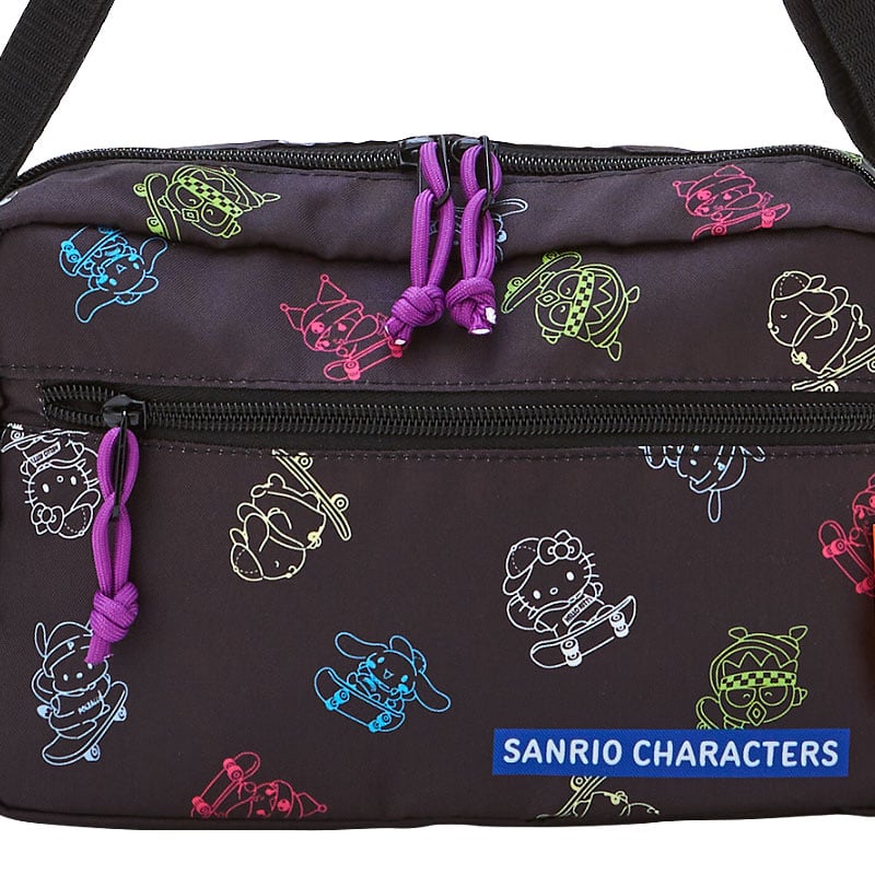Open view of the Sk8r Squad Sanrio crossbody bag highlighting interior pockets.