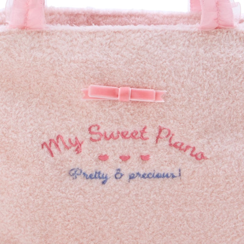 Front view of My Sweet Piano plush handbag showcasing teddy bear ears and soft texture.