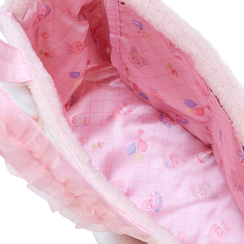 Interior of the My Sweet Piano plush handbag featuring printed lining and internal pockets.