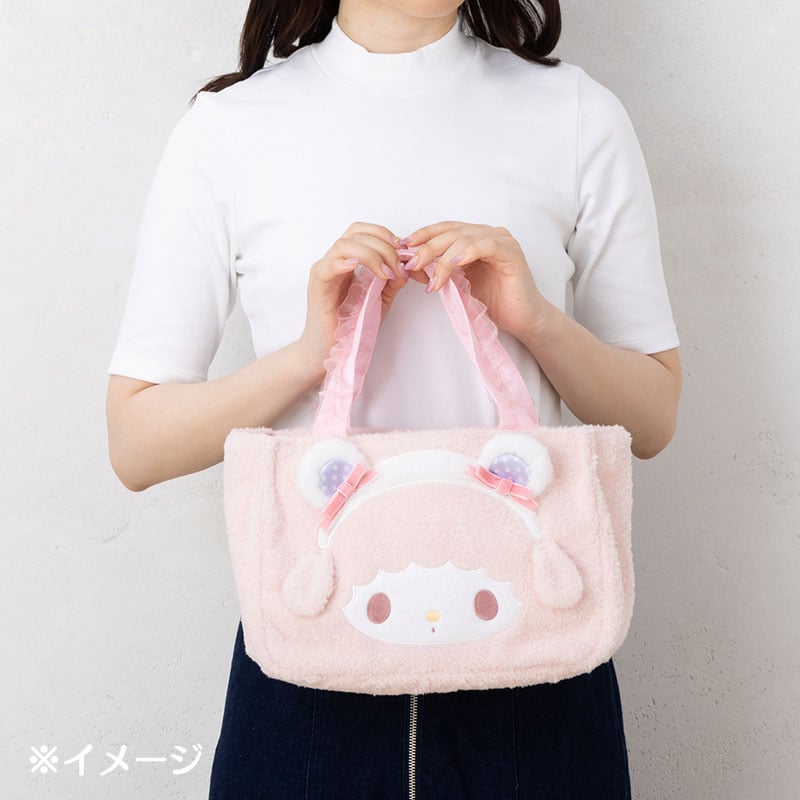Side view of the My Sweet Piano tote bag highlighting its plush material and ruffled details.