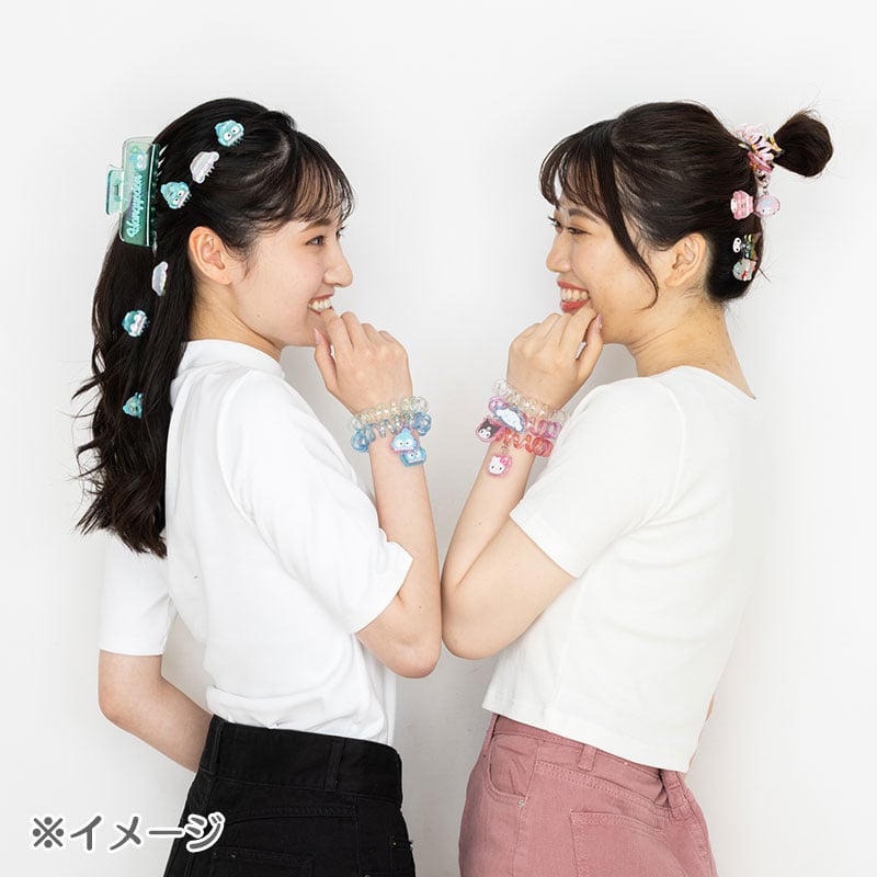 Set of two cute hair accessories with Hello Kitty charms on a white background