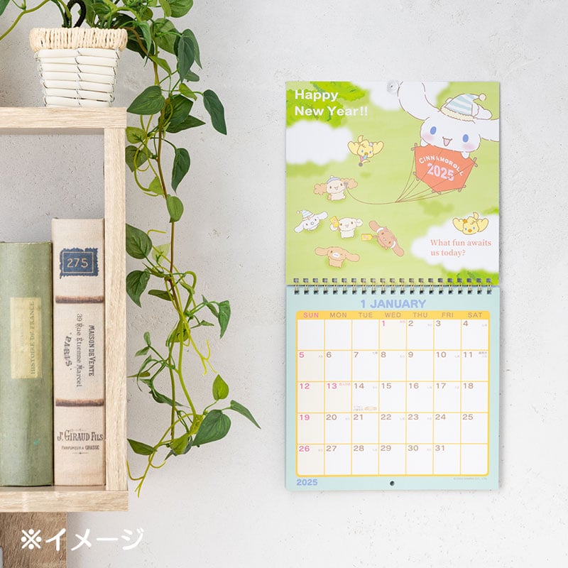 Close-up of the 2025 calendar showing monthly layouts and character art.