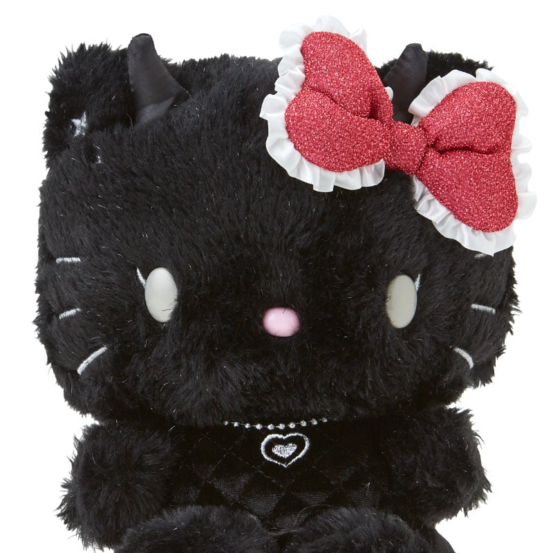 Naughty and Nice Hello Kitty plush with embroidered details, displayed on a shelf