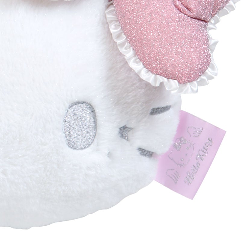 Hello Kitty throw pillow displayed on a gray sofa in a living room