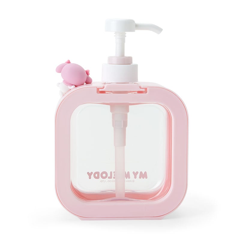 Close-up of transparent bottle showing soap in dispenser with pink accents