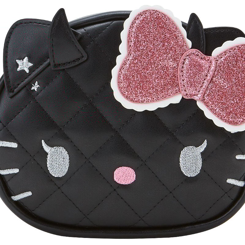Front angle of the Hello Kitty zipper pouch showing quilted texture and heart charm