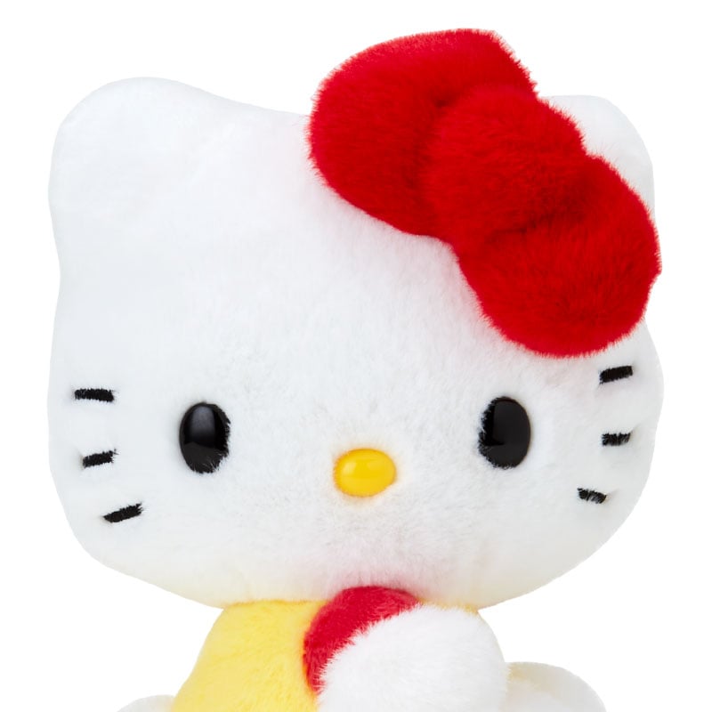 Hello Kitty plush mascot sitting with a cheerful expression, celebrating her 50th year