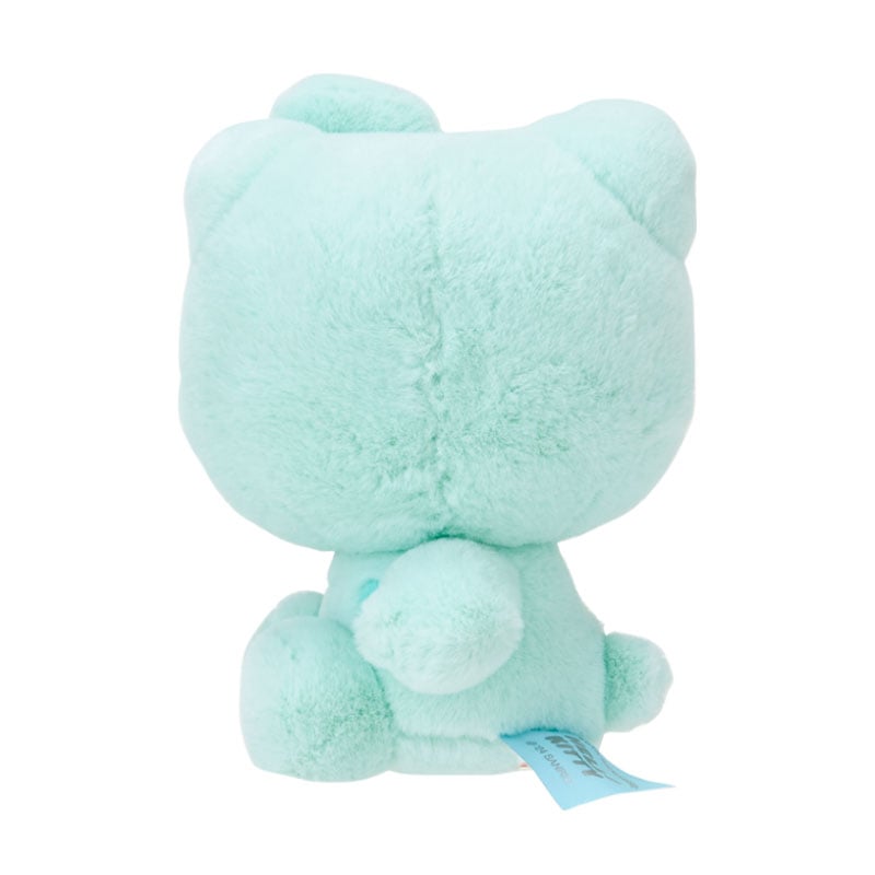 Side view of the plush mascot highlighting its soft texture and anniversary tag