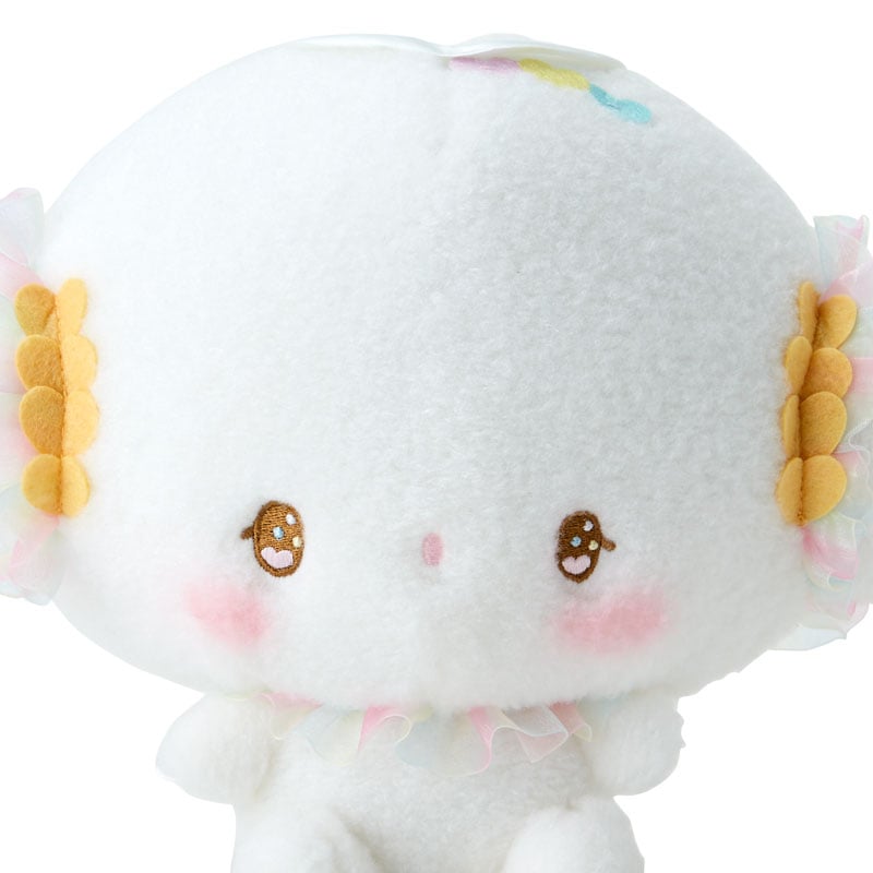 Close-up of the plushs hand-painted cheeks and embroidered features, highlighting its charm.