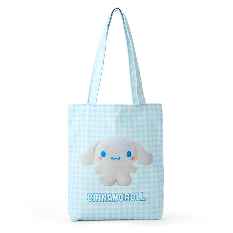 Cinnamoroll Sanrio tote bag held by woman in park setting
