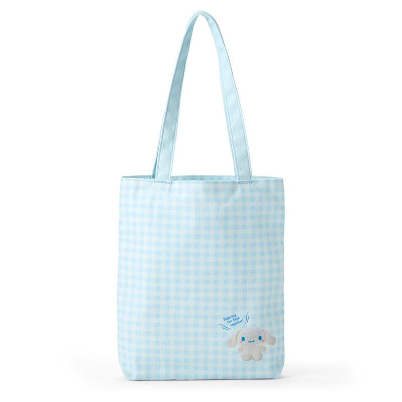 Cinnamoroll Sanrio tote bag held by woman in park setting