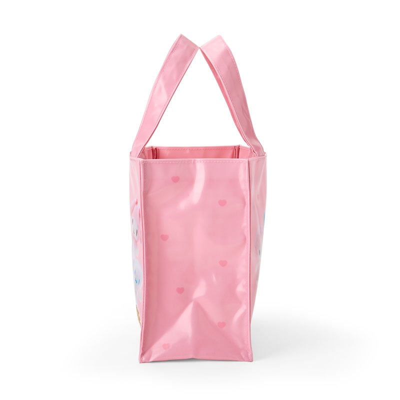 Side profile showing the spacious interior of the mini canvas bag