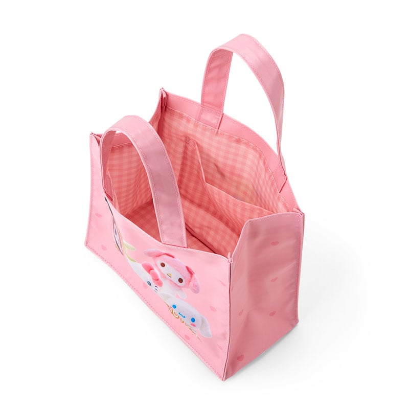 Side profile showing the spacious interior of the mini canvas bag