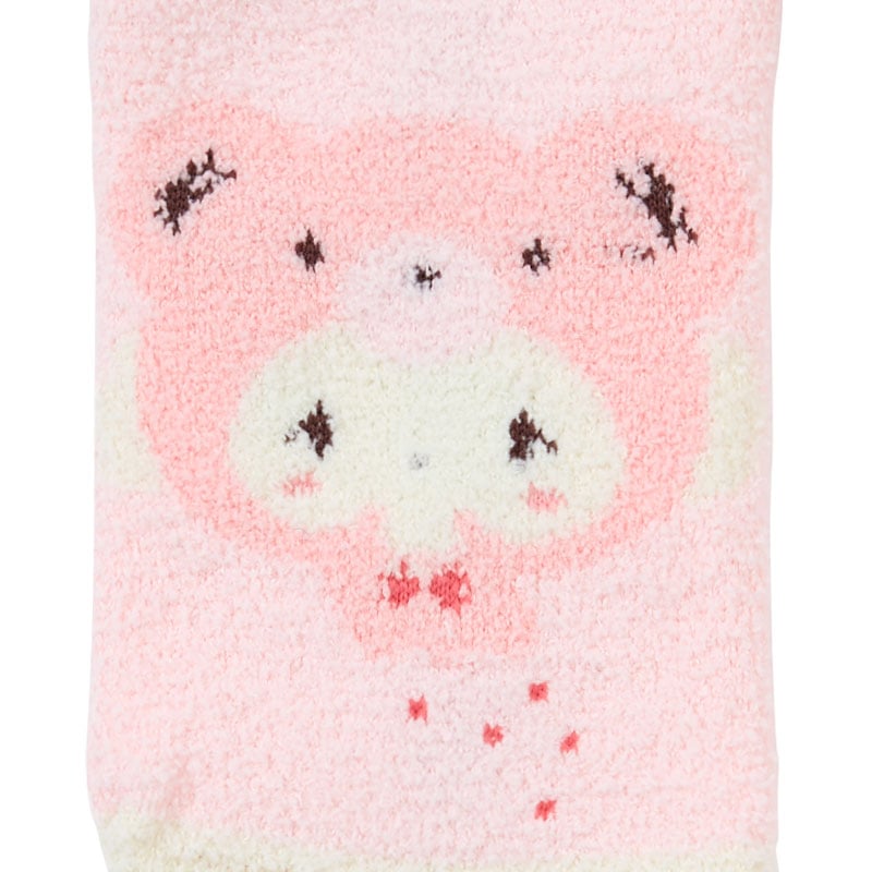 Close-up of plush Sanrio cozy socks showcasing bear designs.
