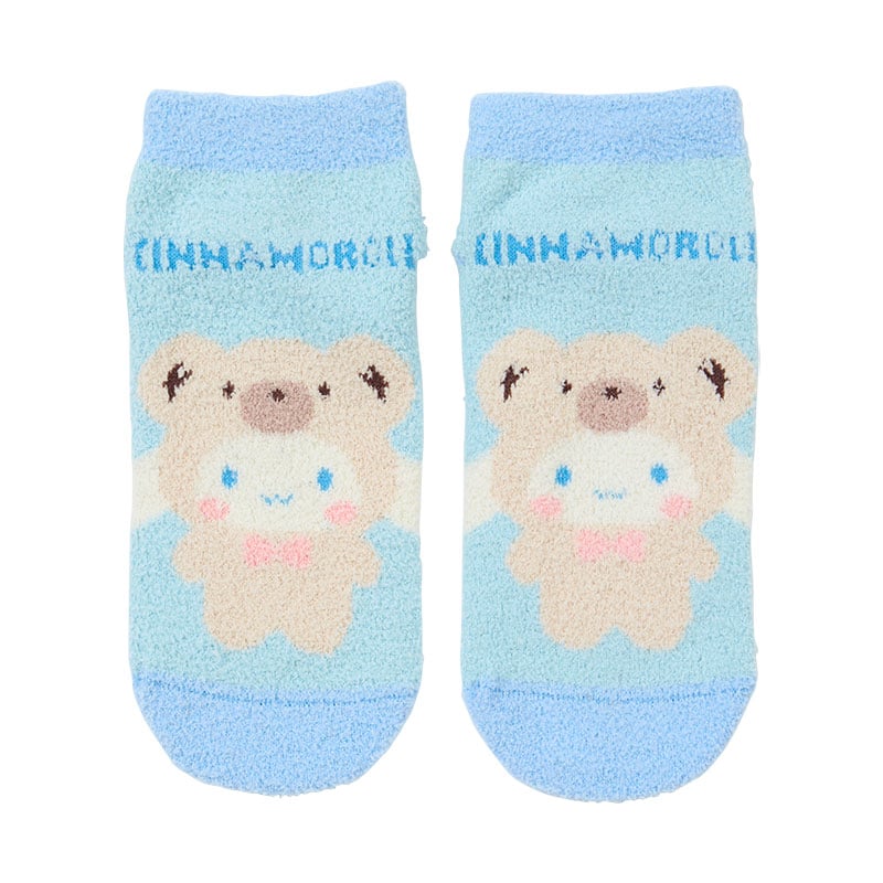 Cinnamoroll teddy bear socks worn on feet, showing the soft plush material