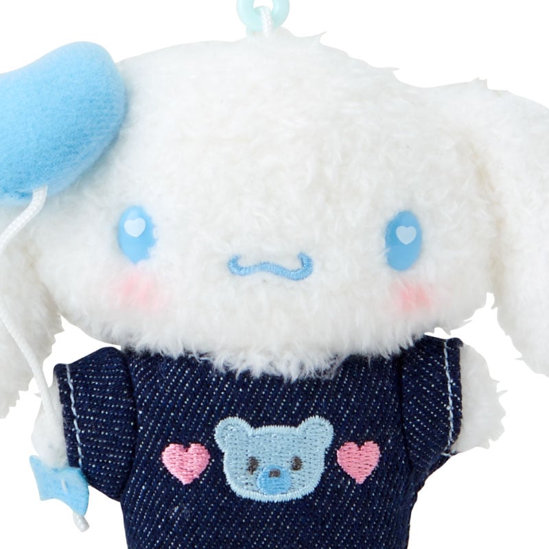 Cinnamoroll keychain clipped to a denim jacket pocket