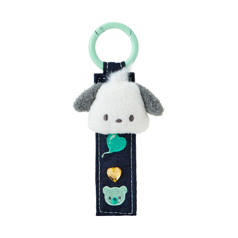 Pochacco denim patch keychain hanging on a backpack with embroidered patches