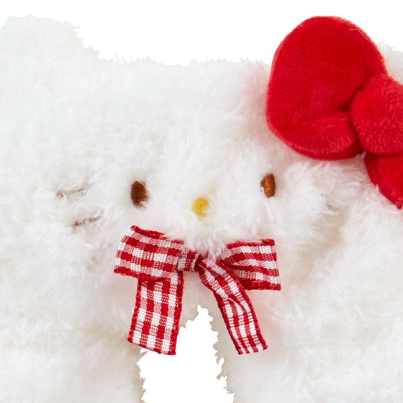 Side angle showing plush texture and bow detail, great as a plush scrunchie for wrist wear.