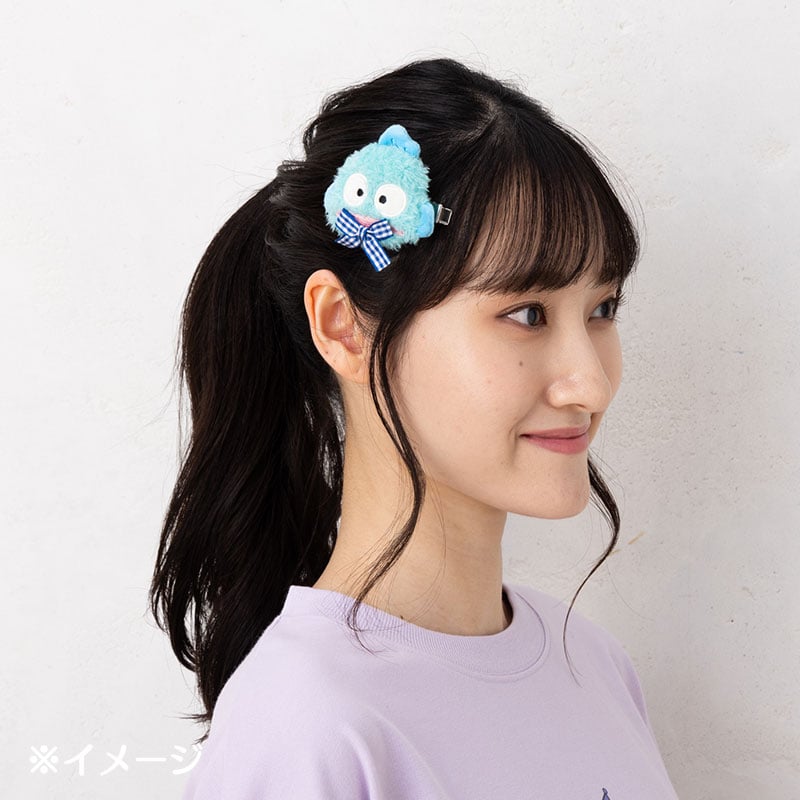 Cute plush hair clip in use, adding flair to an updo