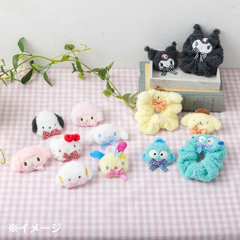 Cute plush hair clip in use, adding flair to an updo