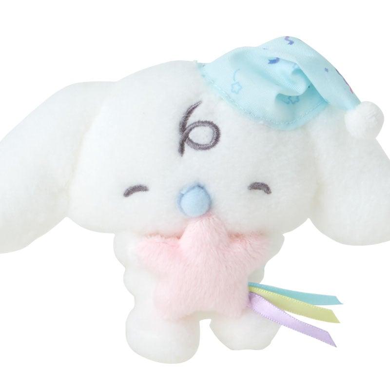Close-up of Cinnamoroll plush character in bedtime theme, soft and adorable
