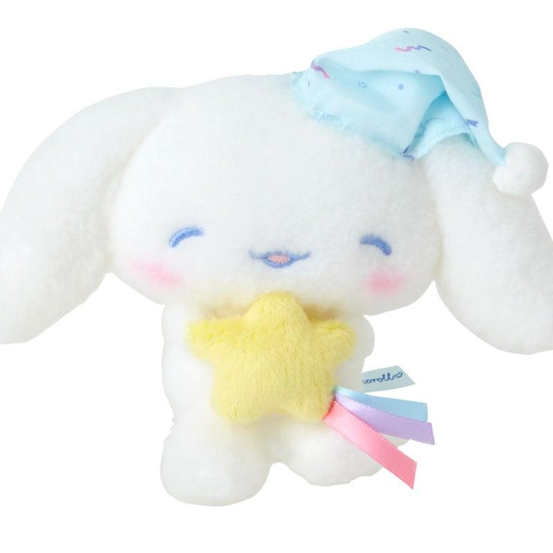 Close-up of Cinnamoroll plush keychain showcasing embroidered features.