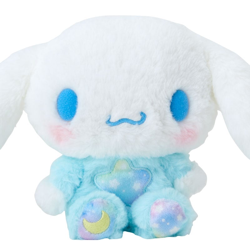 Cinnamoroll plush toy against a starry night backdrop