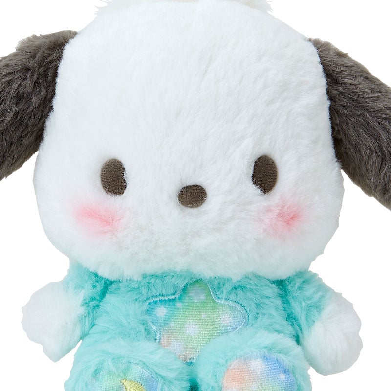 Giant Pochacco plush nestled among pillows for scale