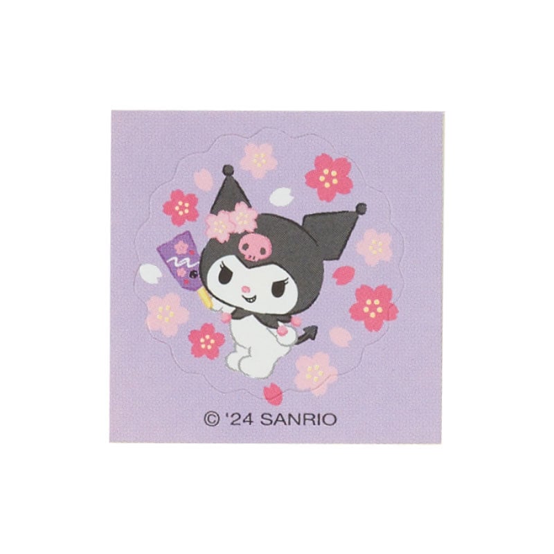 Close-up of the mini sticker seal included with the green envelope.