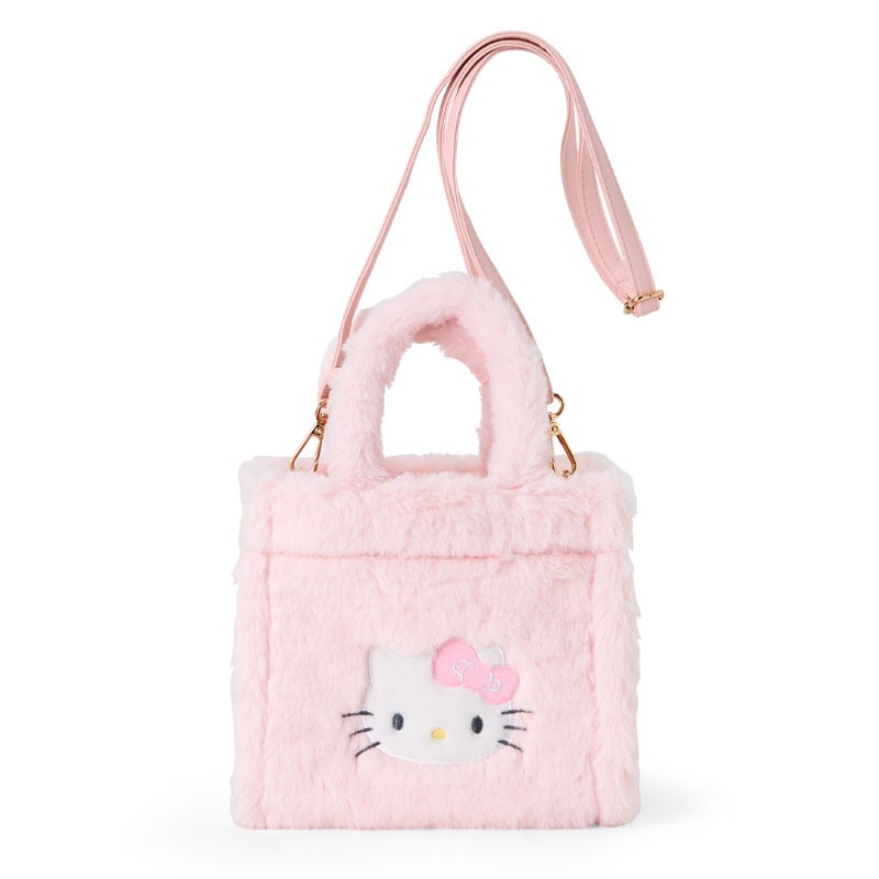 Hello Kitty plush mini tote bag in use as a crossbody, featuring embroidered details.