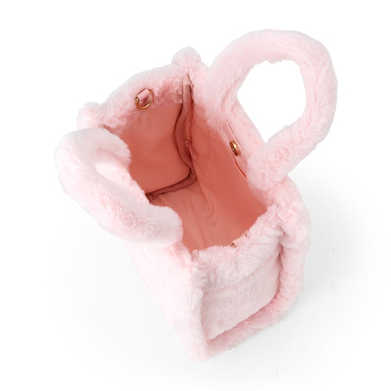 Side angle of the soft plush Hello Kitty bag with adjustable strap