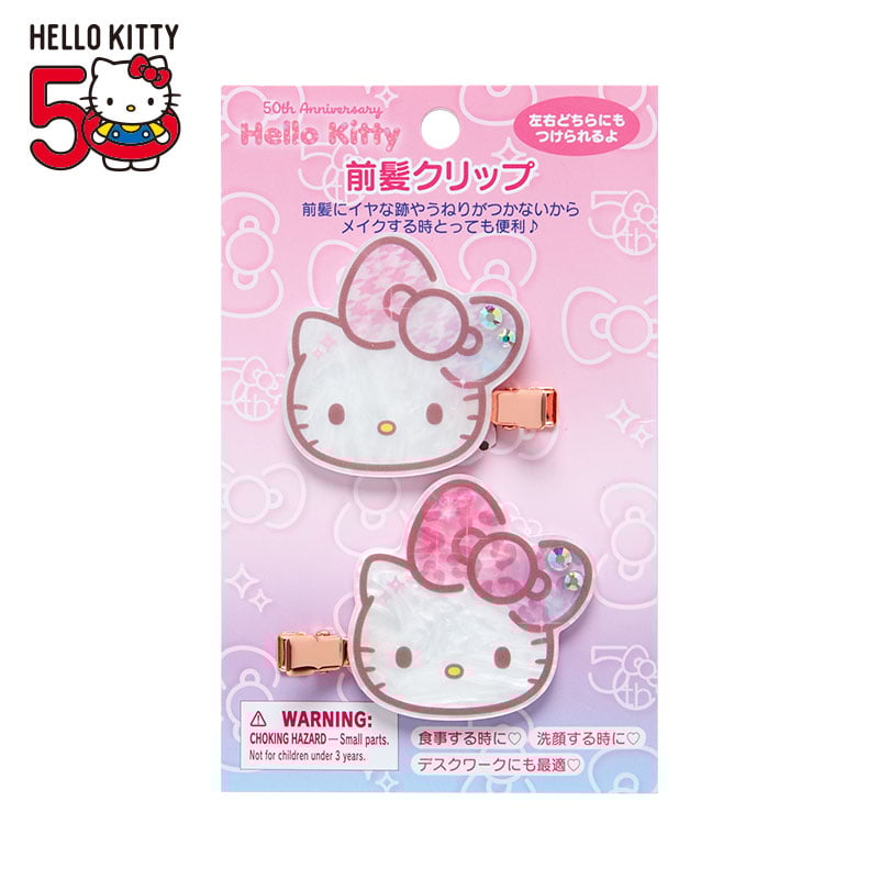 Hello Kitty hair clip with variegated applique bows and sparkling stone accents, right-facing