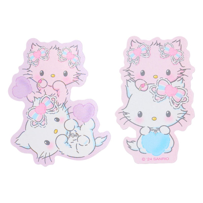 Charmmy Kitty wall stickers arranged on a laptop.