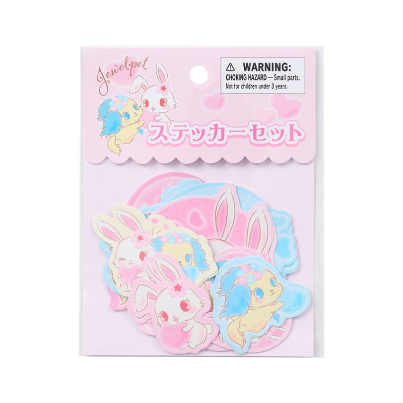 Jewelpet sticker pack laid out on a notebook