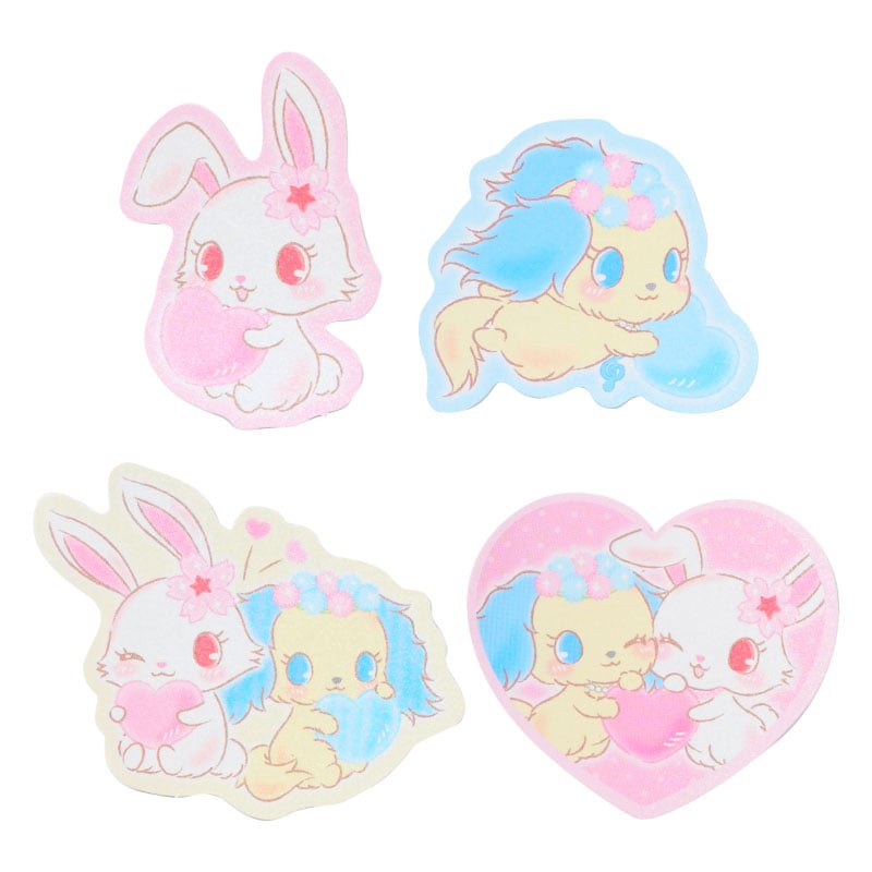 Jewelpet sticker pack laid out on a notebook
