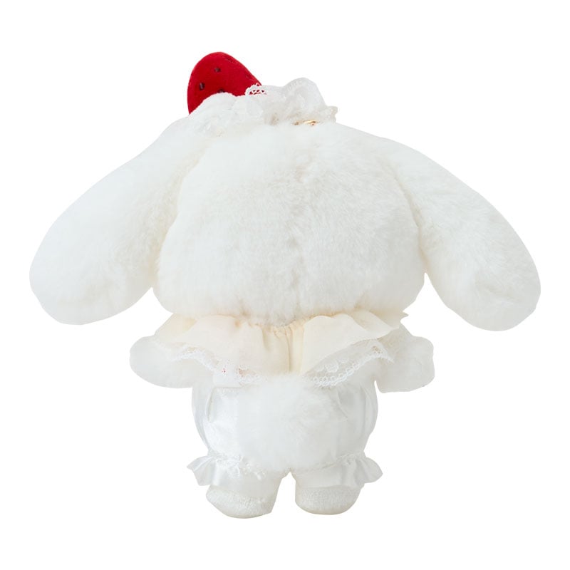 Close-up of embroidered Cinnamoroll plush toy face with painted cheeks.