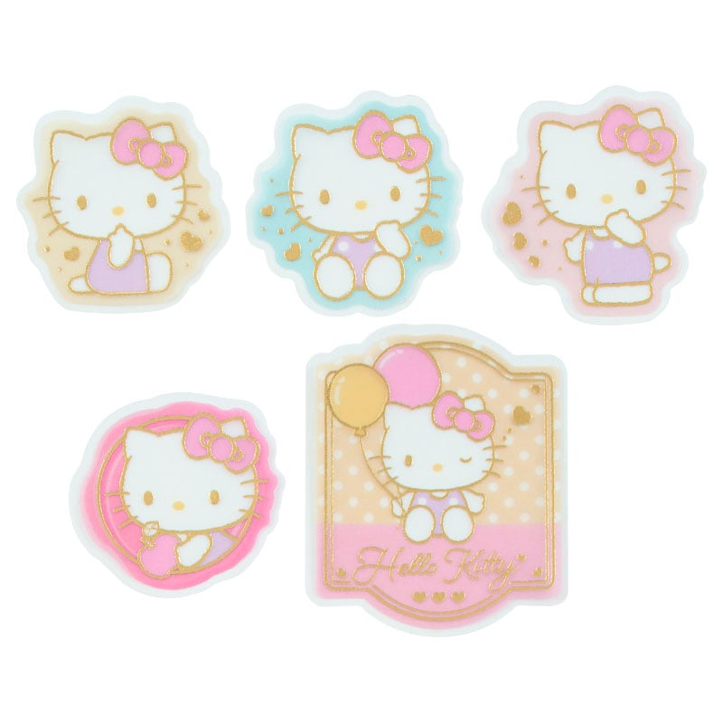 Close-up of Sanrio stickers applied to a laptop and notebook