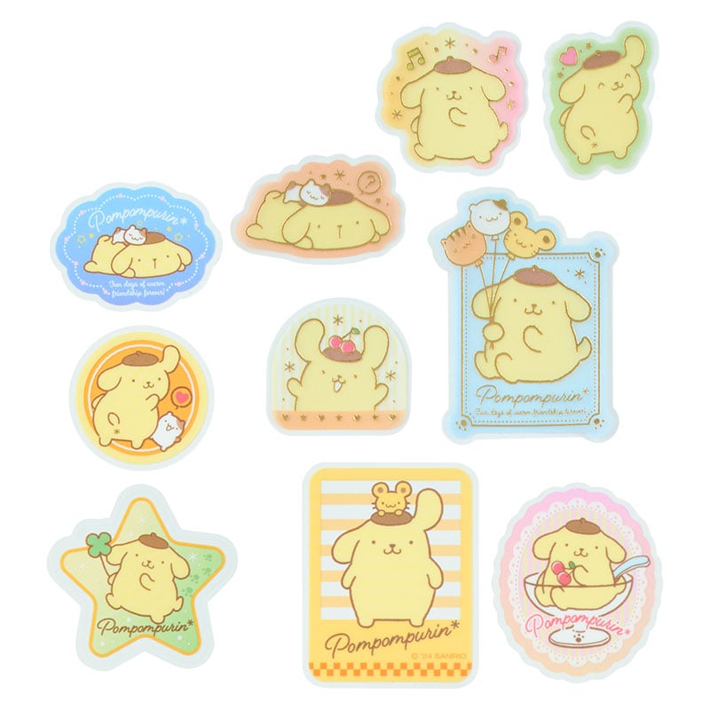 Close-up of Pompompurin Sanrio stickers with gold foil accents on a notebook