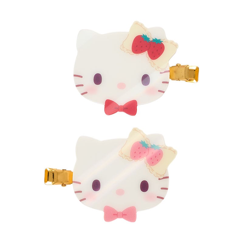 Adorable Hello Kitty hair clips with strawberry accents for playful hairstyles.