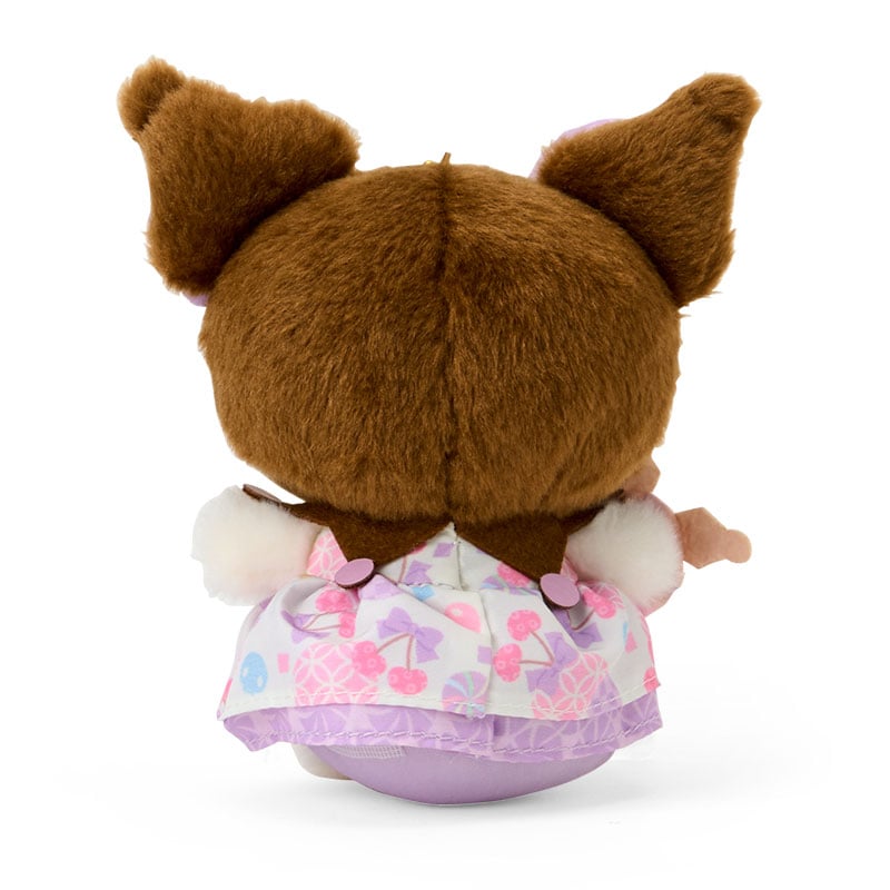 Kuromi plush keychain hanging from a purse with pastel background