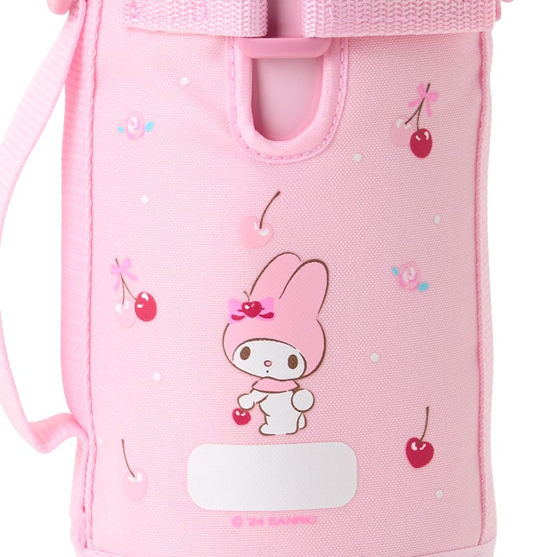 Front view of My Melody stainless steel bottle with carrier on a picnic bench