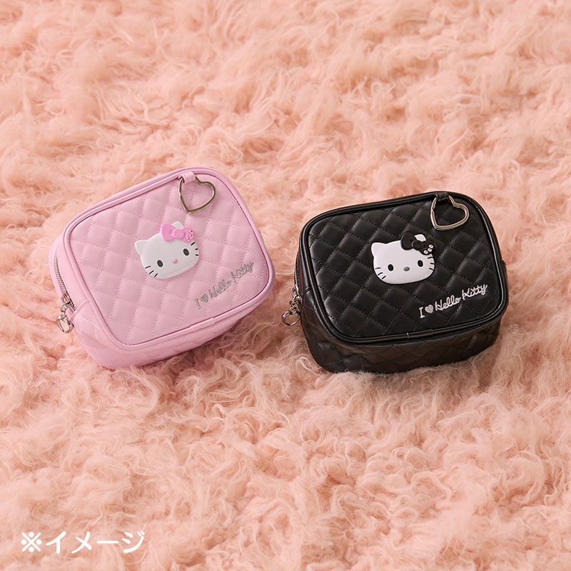 Close-up of the Hello Kitty pouchs quilted design and heart-shaped keyring