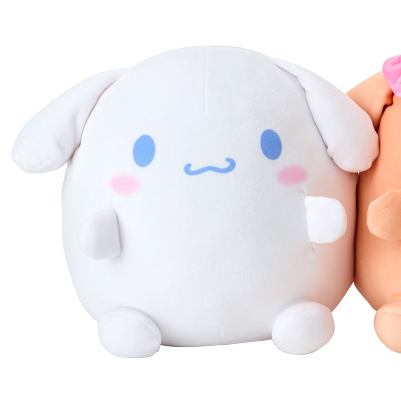Mocha and cinnamoroll plush big duo styled separately on a pastel couch in a small apartment