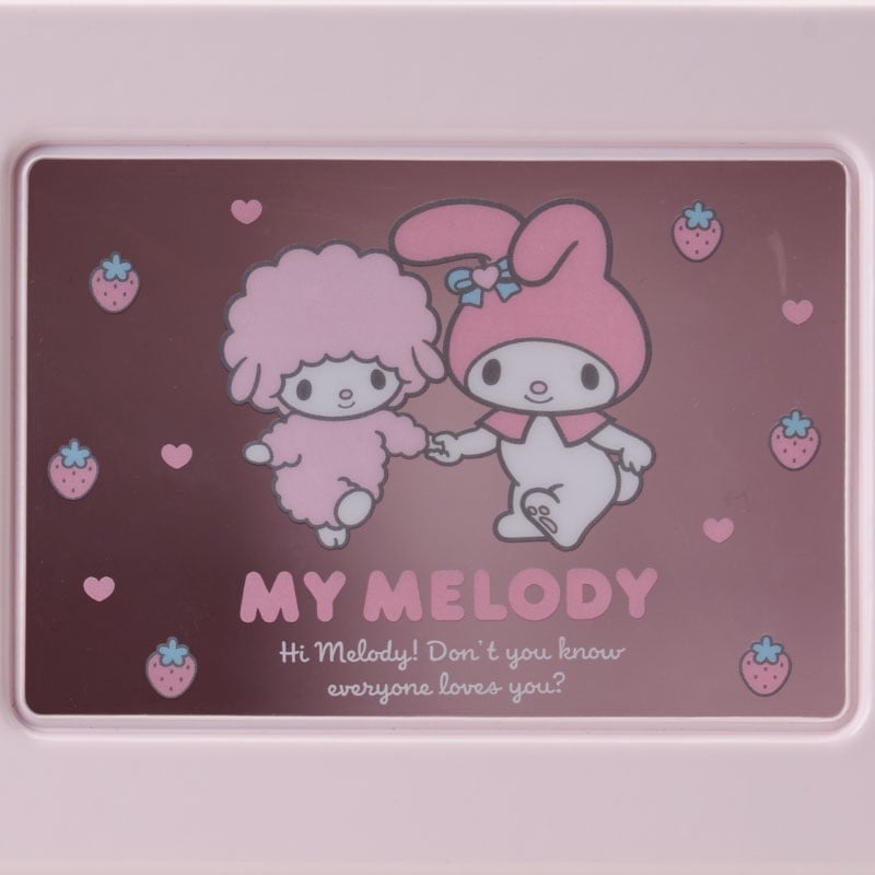 My Melody mini suitcase displayed with vibrant Sanrio character collectibles.