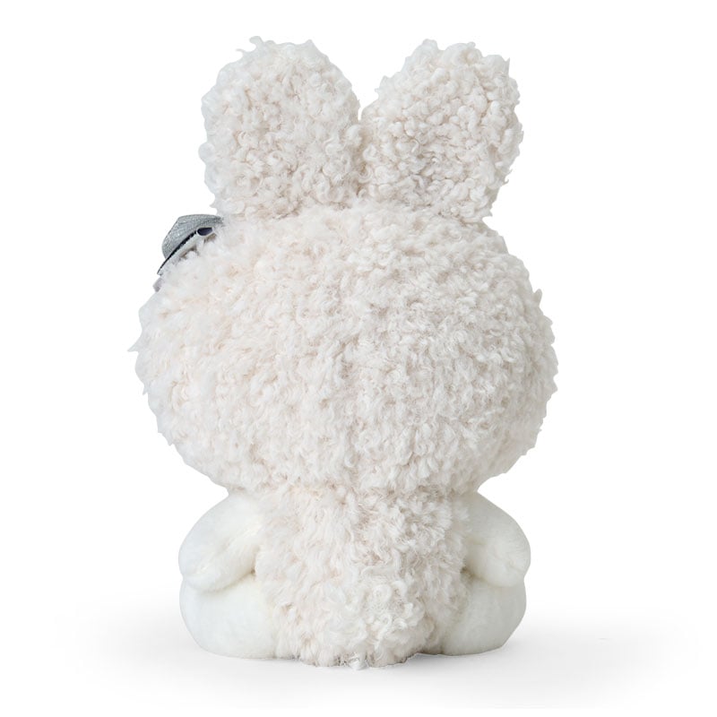 My Melody plush surrounded by snowy scenery or winter-themed decor
