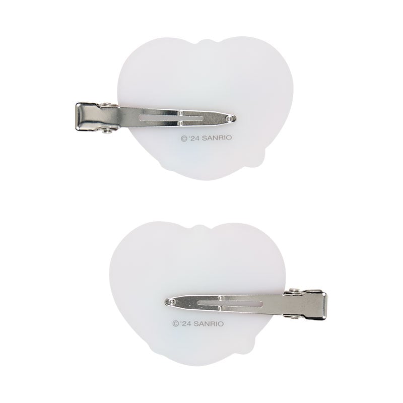 Hello Kitty mini hair clips duo, right and left facing, demonstrating their use for securing stray hairs.