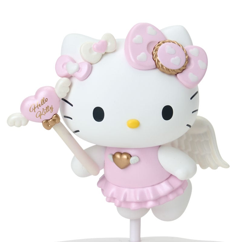 Front view of Hello Kitty figurine with pedestal inside display box