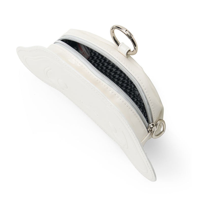 Open pouch showing interior lining and zipper, placed beside Sanrio hair accessories